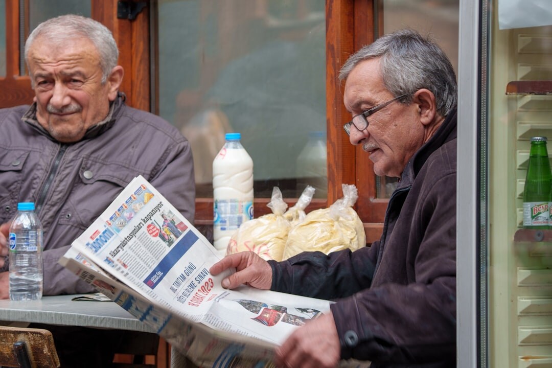 senior couple reading newspaper