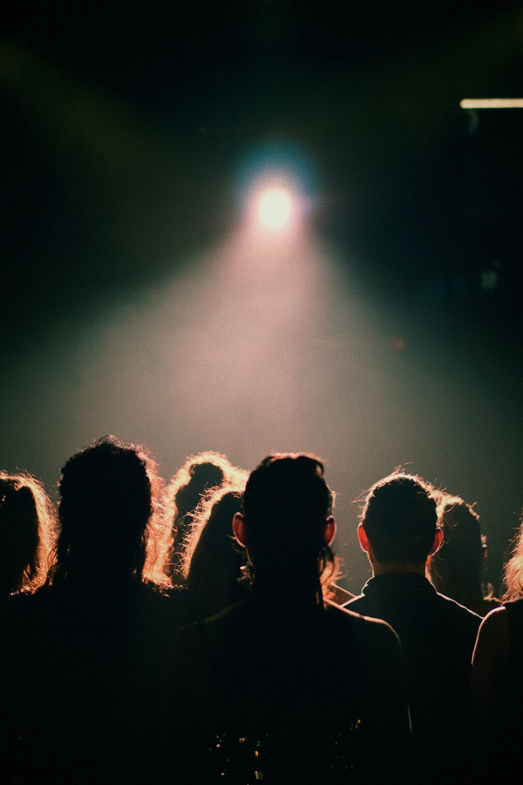 Seniors sitting in a theatre audience watching a performance